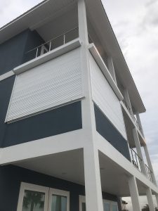 Exterior shot of a home with roll-down hurricane shutters